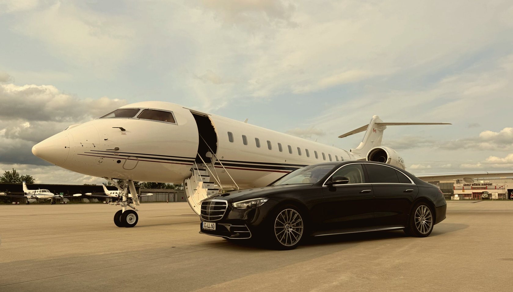 LiMotion® S-Class beside a private jet at Adolf Würth Airport